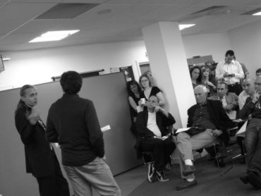 Sergei Guz (left) talks with Branch members; © Sara Haq