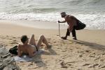 Beach Vendor and Tourist © Don Tonge
