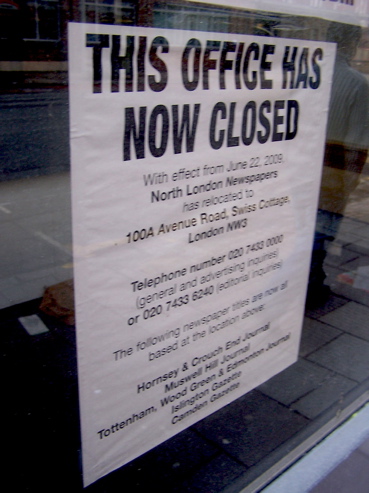 Sign reads: 'This office has now closed... North London Newspapers has relocated...