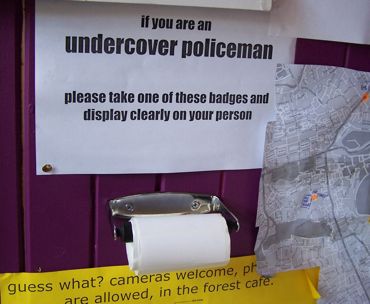 Humorous "undercover policeman" badges at protest caf&eacute; Edinburgh, 2005 &copy; Matt Salusbury