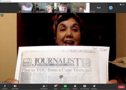 Zubeida Jaffer holding up the Journalist - see caption
