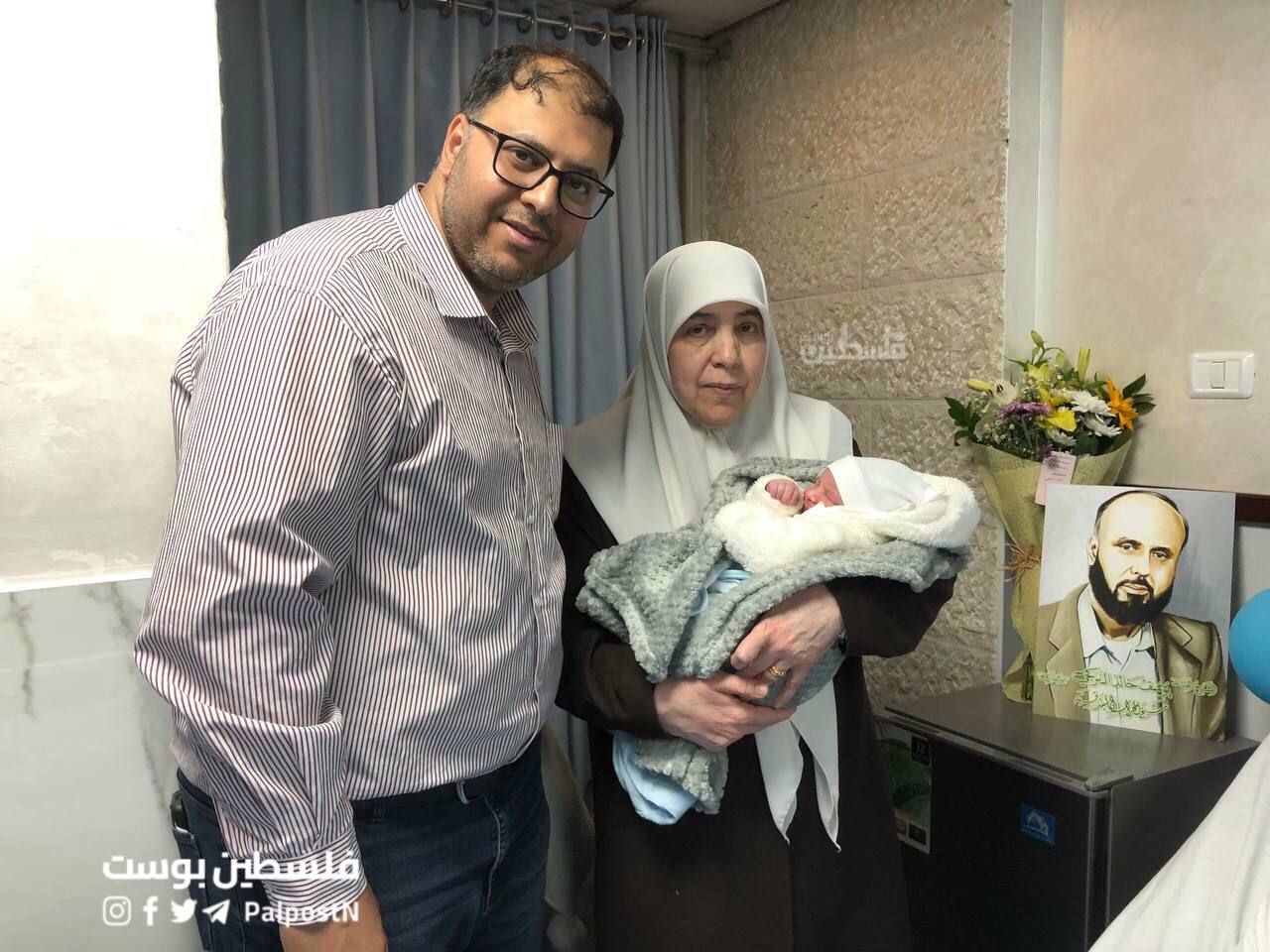 Two adults and a newborn