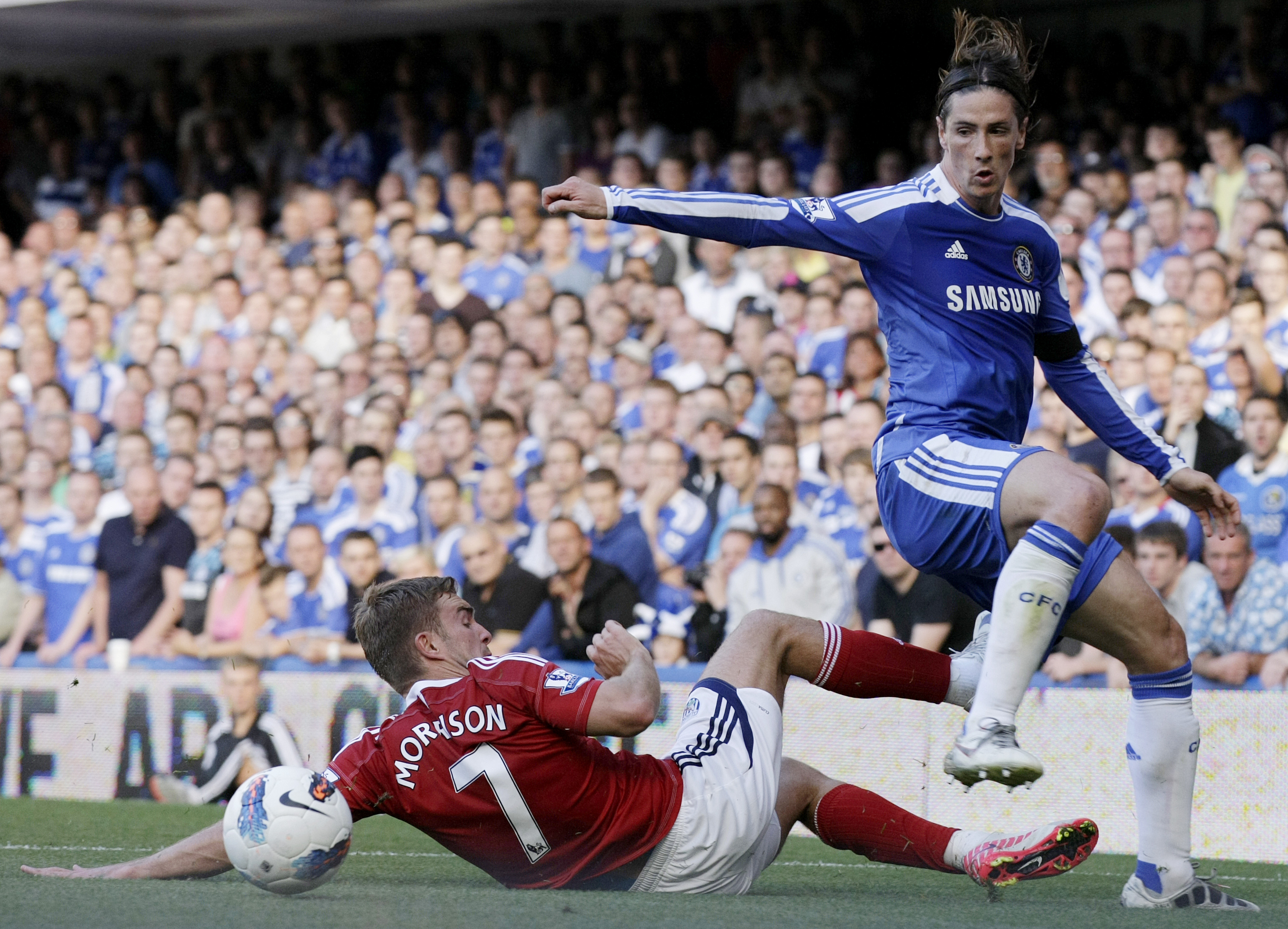 © Jonathan Brady unless specified otherwise below Fernando Torres (R) is tackled off of the ball by West Bromwich Albion's James Morrison (L): © Jonathan Brady unless specified otherwise below