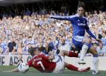 Fernando Torres (R) is tackled off of the ball by West Bromwich Albion's James Morrison (L) © Jonathan Brady