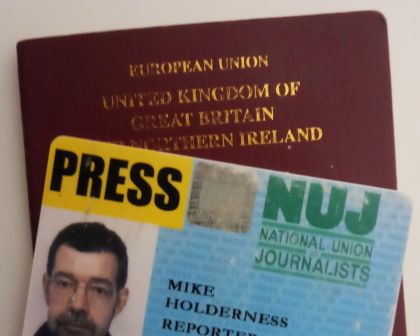Passport, press card...