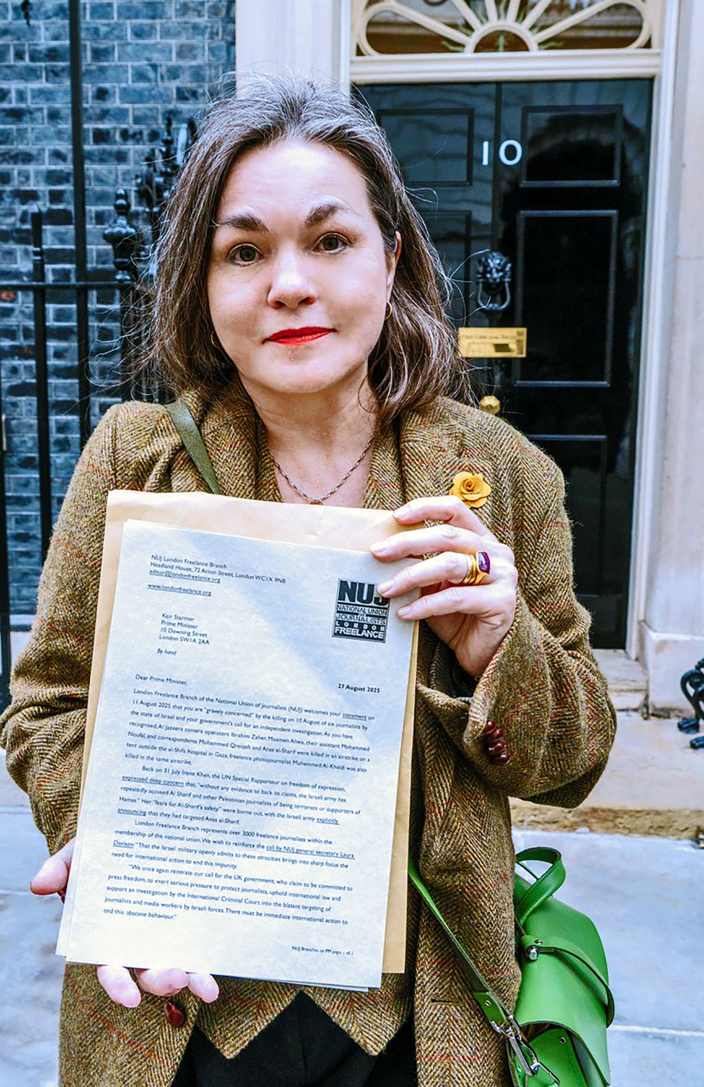 Pennie Quinton with the letter outSIde Number 10